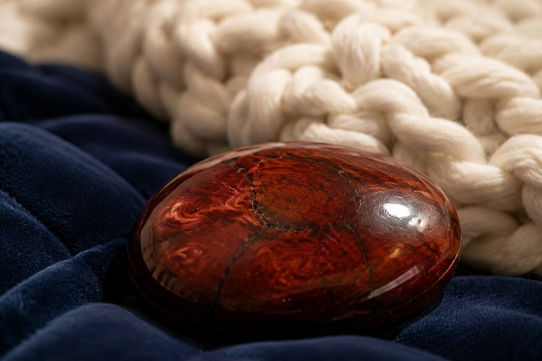 Macro detail of high-quality mahogany petrified wood and organic chunky knit weighted blanket by Vivera Living