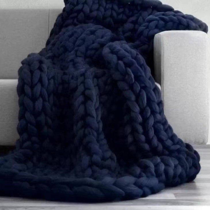 Cream colored chunky knit throw blanket as cozy minimalist home decor for living room or bedroom