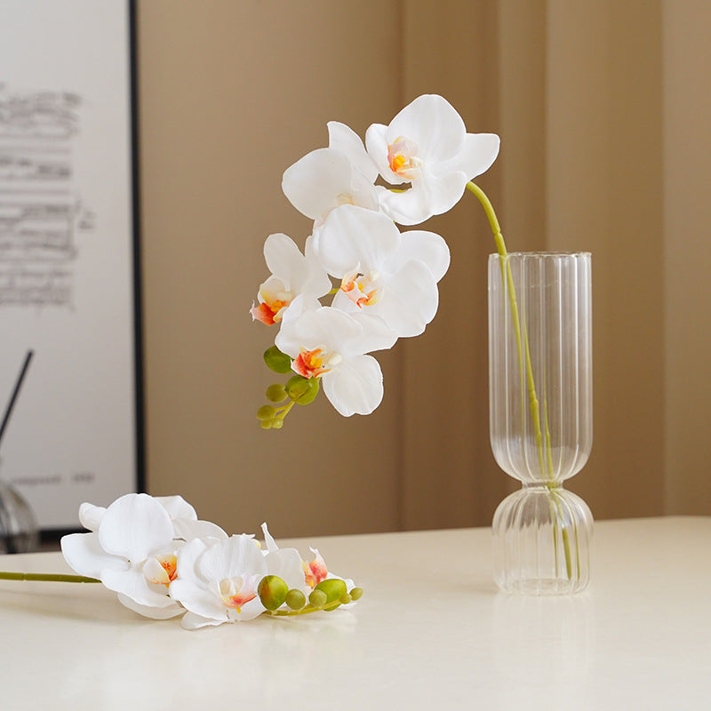 Realistic artificial white butterfly orchid in clear glass vase for minimalist home decor - The Silent Bloom by Vivera Living